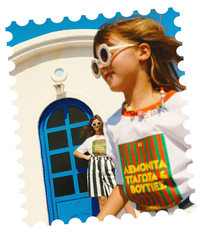 Girl in sunglasses in front of a blue door